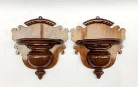 A pair of late Victorian mahogany wall brackets