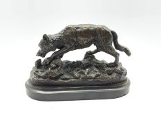 Patinated bronze study of a Wolf Hunting scene on stepped marble plinth