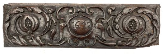 17th Century oak panel carved with foliate scrolls and dated 1642 in a central cartouche 15cm x 50cm