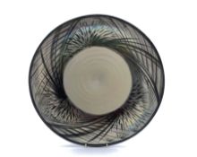 John Dunn (b1944): large circular iridescent glazed bowl with painted foliate border