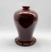 20th century Chinese Sang De Boeuf baluster form vase and stand