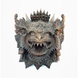 Eastern carved hardwood mask modelled as a mythical creature