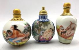 Three Chinese snuff bottles decorated with erotic scenes and blue character marks to base