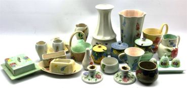 A collection of Radford hand-painted pottery to include a trio of Crocus shaped vases