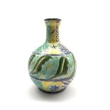 Della Robbia bottle shaped vase painted and incised with stylised leaf and scaled decoration