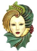 Painted pottery face mask modelled as a lady wearing an elaborate headdress