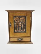 Early 20th Century oak smokers cabinet of Art Nouveau design with lifting top