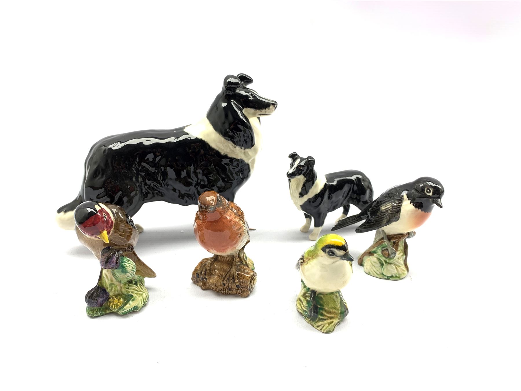 Two Beswick Border Collie models together with four Beswick Birds: Goldcrest