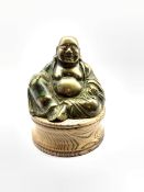 Brass model of a seated Buddha on oak plinth