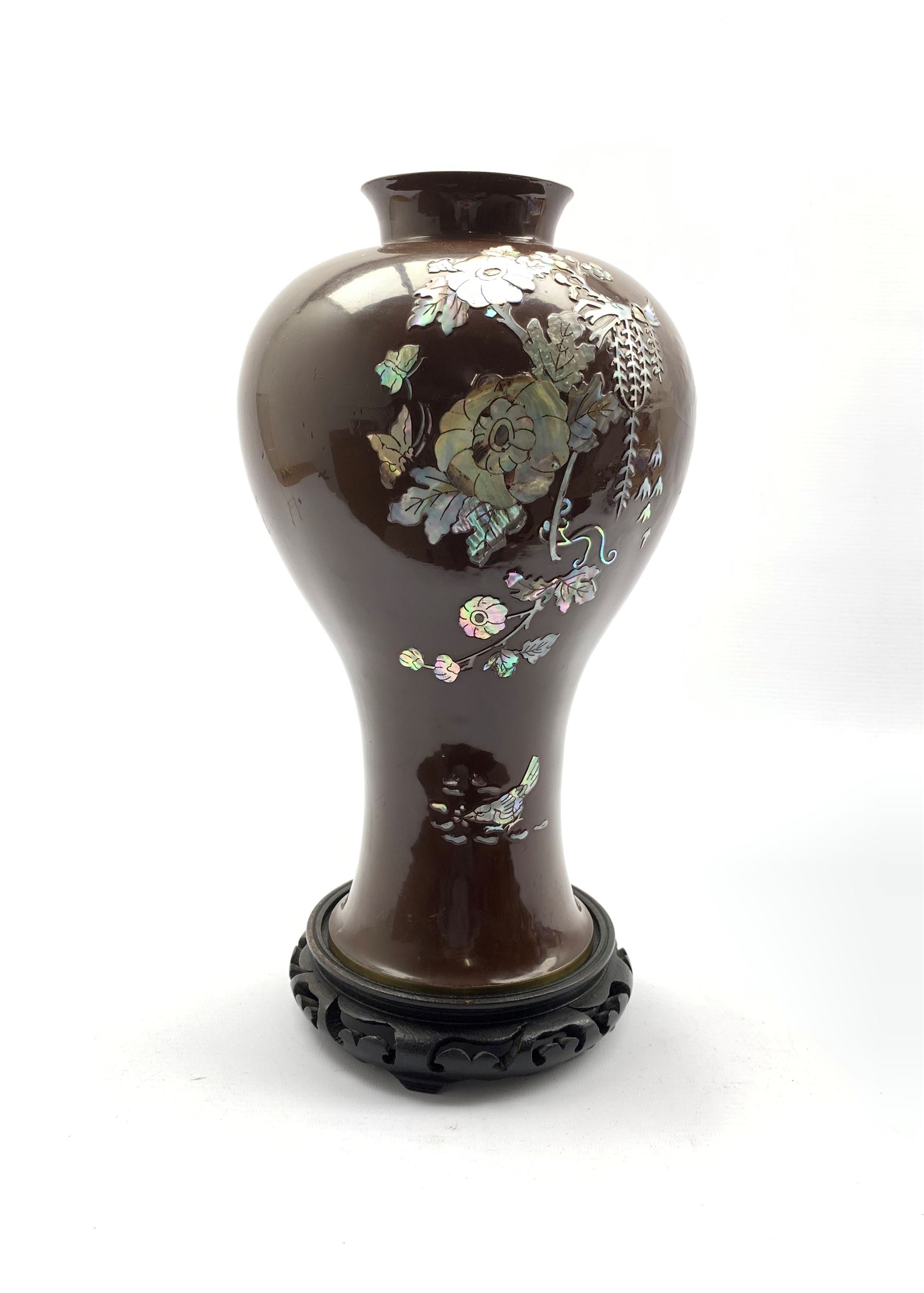 Oriental lacquer and mother-of-pearl inlaid vase of inverted baluster form on stand