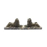 Pair of Victorian bronze figures of recumbent lions on marble plinths