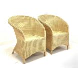 Pair of tub shaped wicker conservatory chairs W69cm together with a circular bamboo table with glass