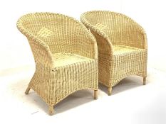 Pair of tub shaped wicker conservatory chairs W69cm together with a circular bamboo table with glass