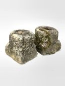 Two small carved and well weathered post base stones W27cm