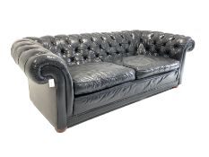 Tetrad Chesterfield three seat sofa upholstered in deep buttoned black leather with squab cushions W