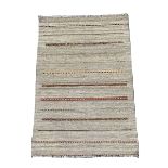 Flat weave brown ground rug