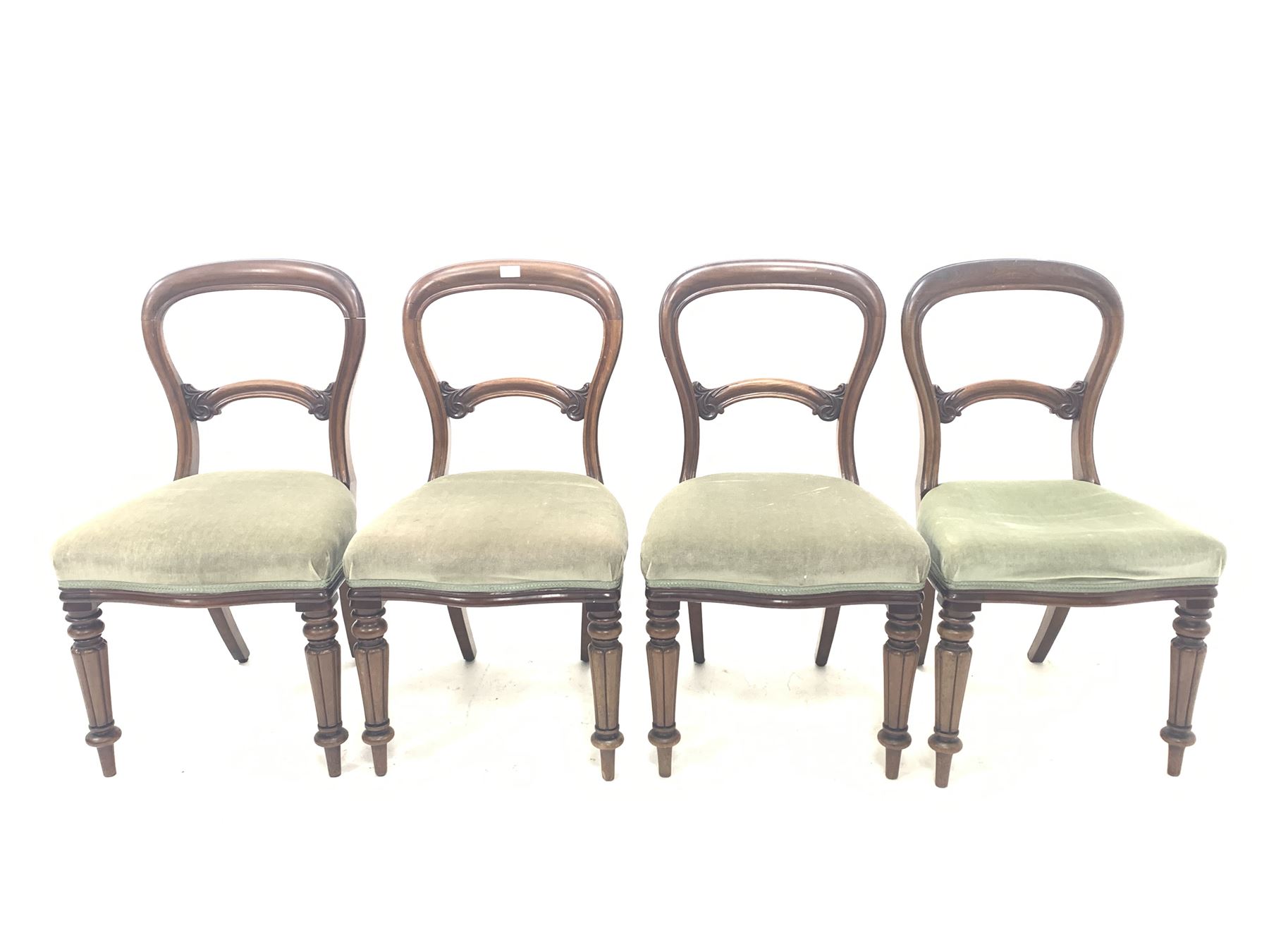 Set of four Victorian dining chairs with balloon backs and scroll leaf carved rails