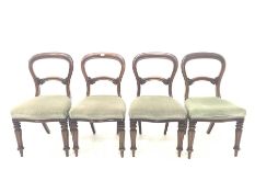 Set of four Victorian dining chairs with balloon backs and scroll leaf carved rails