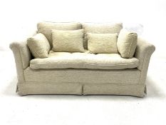 Two seat sofa upholstered in beige fabric