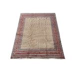 Large Persian Araak red ground carpet