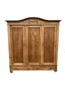 Late 19th century Continental pine triple wardrobe