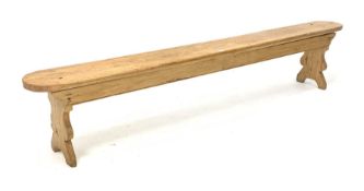 20th century pine bench raised on shaped panel end supports
