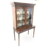 Early 20th century Chippendale style mahogany bookcase on stand