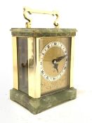 An 'Elliott' early 20th century brass and onyx carriage time piece clock