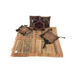Middle Eastern flatweave and tufted brown ground rug with a cross design