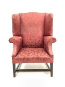 Georgian style high wing back armchair upholstered in claret red floral fabric