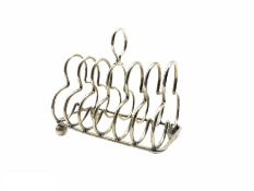 Late Victorian silver six division toast rack with loop handle and ball feet London 1897 Maker Frede