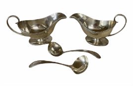 Pair of silver sauce boats with harebell moulded edge and loop handle on an oval foot Sheffield 1926