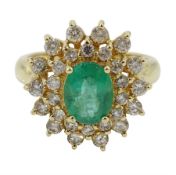 Gold oval emerald and round brilliant cut diamond cluster ring