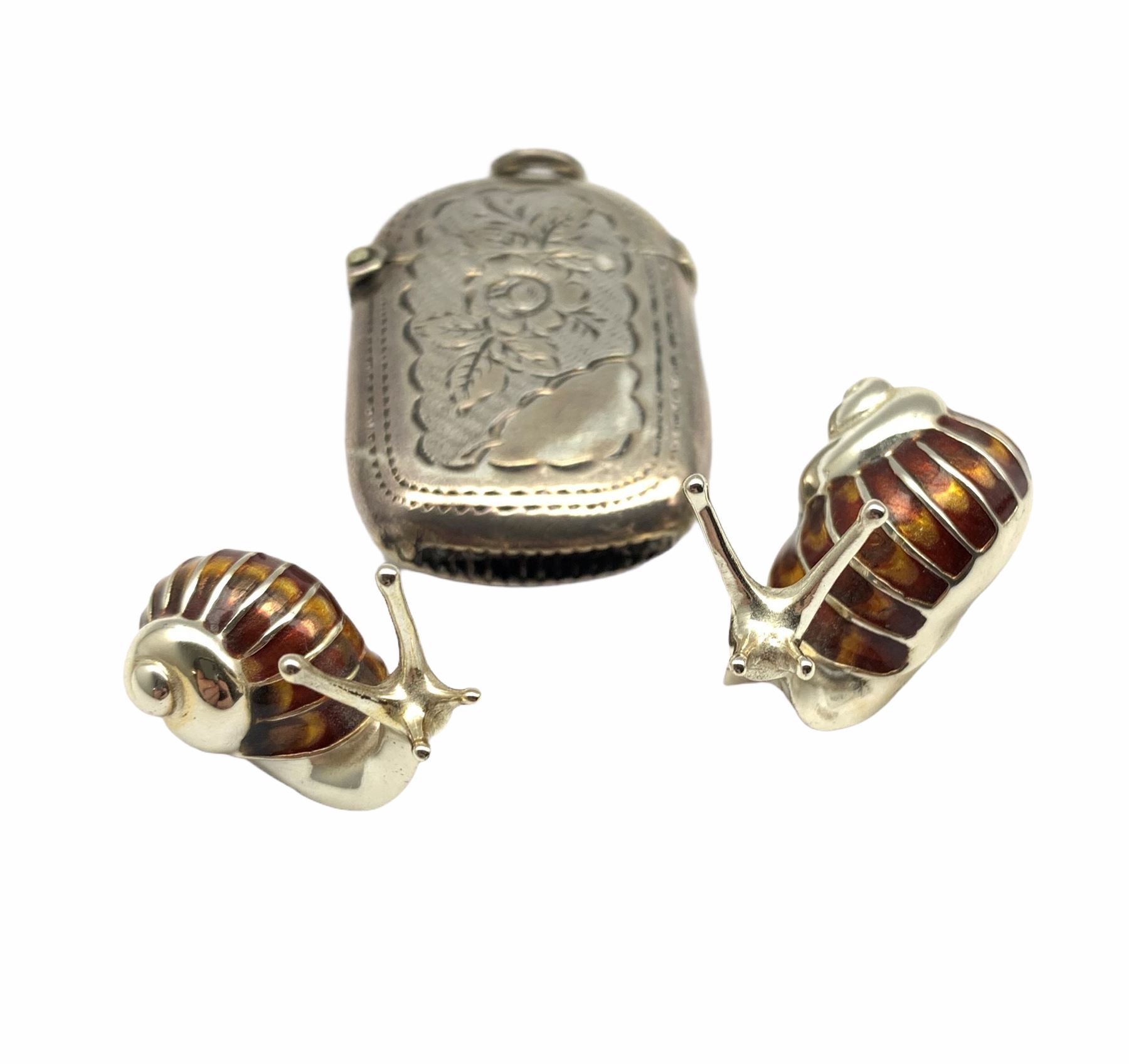 Pair of graduated silver and brown/amber enamel snails