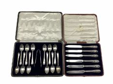 Set of twelve silver rat tail pattern coffee spoons and tongs London 1928 Maker Josiah Williams & Co