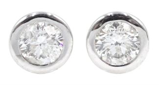 Pair of 18ct white gold bezel set diamond stud earrings