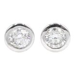 Pair of 18ct white gold bezel set diamond stud earrings