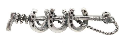 Silver horseshoe and crop brooch