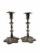 Pair of George II cast silver candlesticks with removeable unmarked shell moulded sconces