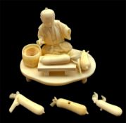 Japanese Meiji sectional ivory Okimono of a farmer preparing vegetables