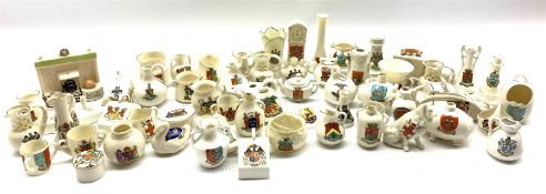 Collection of crested ware including World War I tank and ambulance with the arms of Redcar