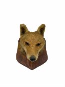 Taxidermy - Fox mask on oak wall shield with a paper label inscribed F E Potter Taxidermist