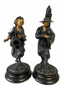 Pair of spelter figures modelled as a wine seller and companion figure with gilded highlights