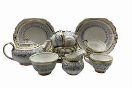 New Chelsea tea set decorated with trailing leave within a gilt band comprising seven cups