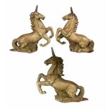 Series of three painted plaster figures of prancing unicorns H46cm