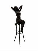 Art Deco style bronze modelled as a female figure seated upon a chair