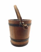 Early 20th century coopered oak fire bucket with rope twist and leather clad handle