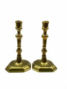 Pair of 18th century brass candlesticks with fluted and baluster knop stems and octagonal bases H20c