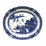 Late 18th/early 19th century Chinese export oval meat plate decorated in blue and white with a river