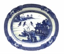 Late 18th/early 19th century Chinese export oval meat plate decorated in blue and white with a river
